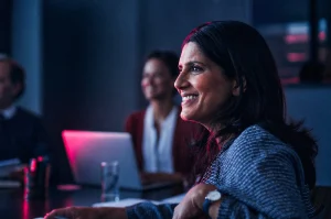 woman-smiling-at-speaker